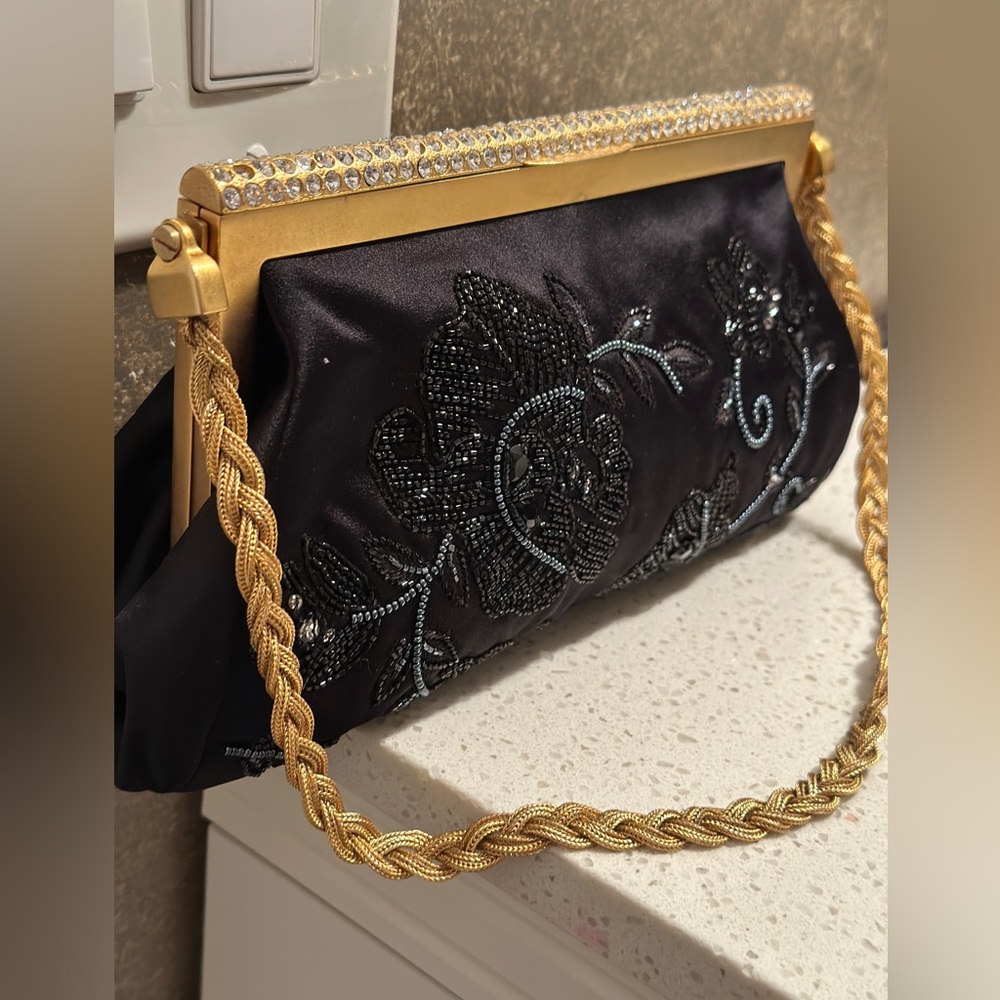 Black clutch bag from Valentino a gold tone frame with diamanté embellished